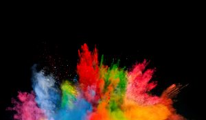 Freeze motion of colored dust explosion isolated on black